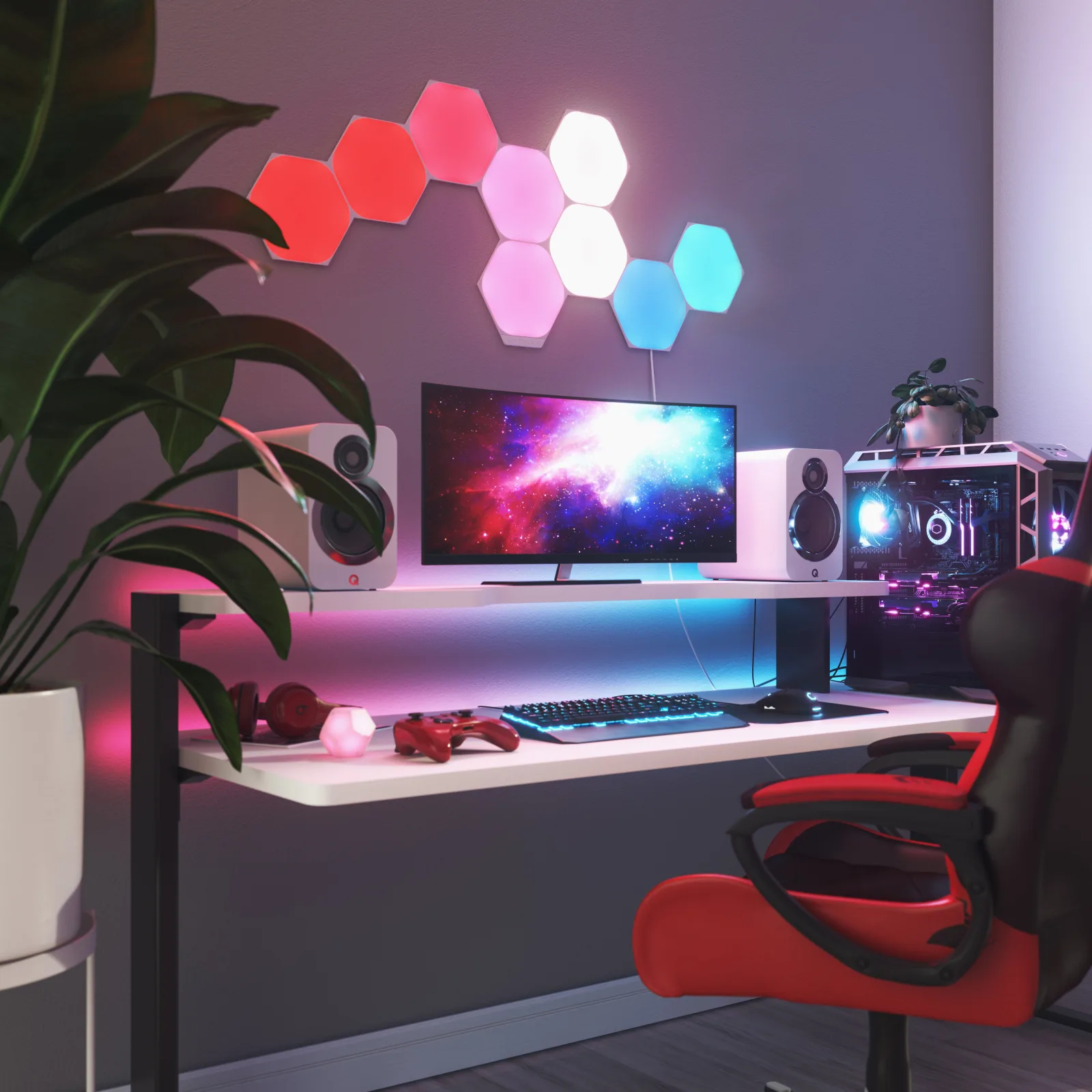 Panneaux hexagonaux Nanoleaf Shapes allumés en rose et bleu au-dessus d’un bureau