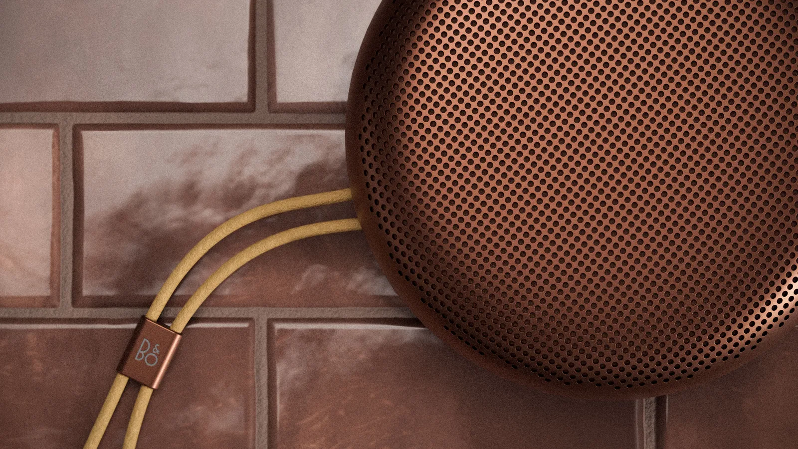 Enceinte Bang & Olufsen Beosound A1 3e génération rouge vue de dessus, avec sa sangle en cuir — vue 3